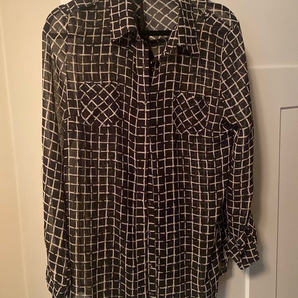 In style, beige and black sheet top with black camesol